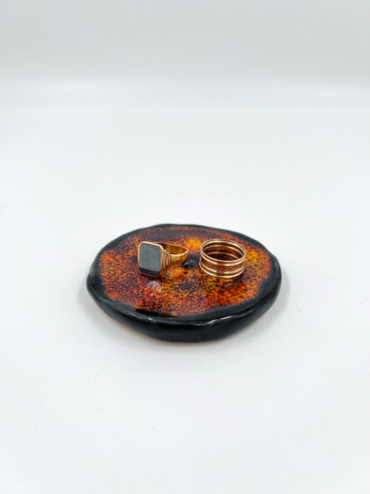 Blombruden litet fat svart orange